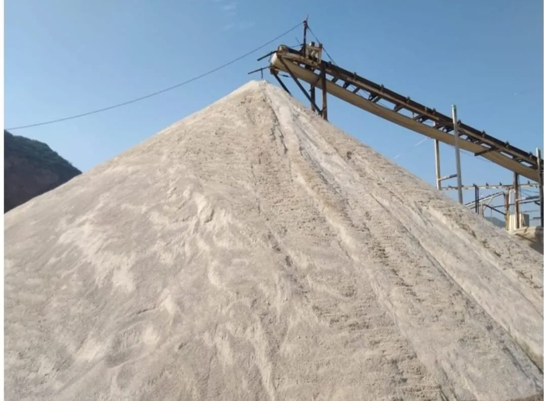 Manufactured sand stockpile under the crusher conveyor